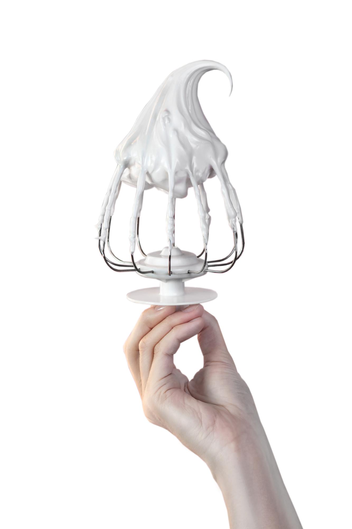 Hands finishing a dessert with torch